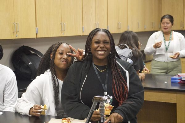 Students gather to eat pizza together at the first Black Student Union meeting of 2024. 